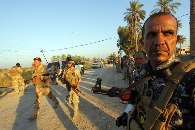 Iraq army backed by Shi'ite fighters begin biggest operation in Tikrit