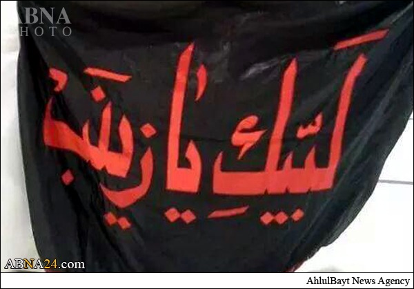 Photos: Sayyidah Zaynab Mosque Defender Raises Banner of "Ya  Zaynab" at Holy Kaaba