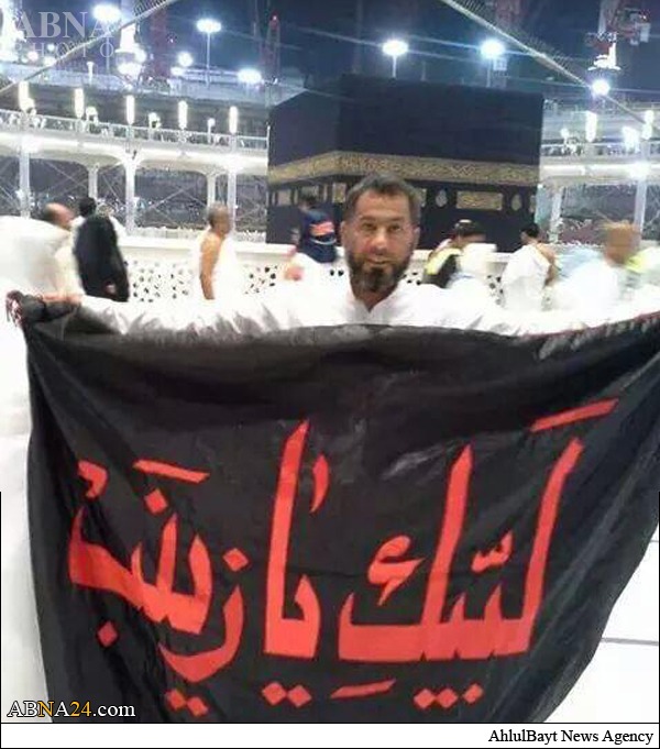 Khadem hängt Flagge Zainabs an der Heiligen Kabah auf