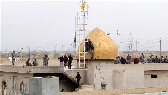 Iraqi forces backed by Shia, Sunni volunteers retake Tikrit Grand Mosque