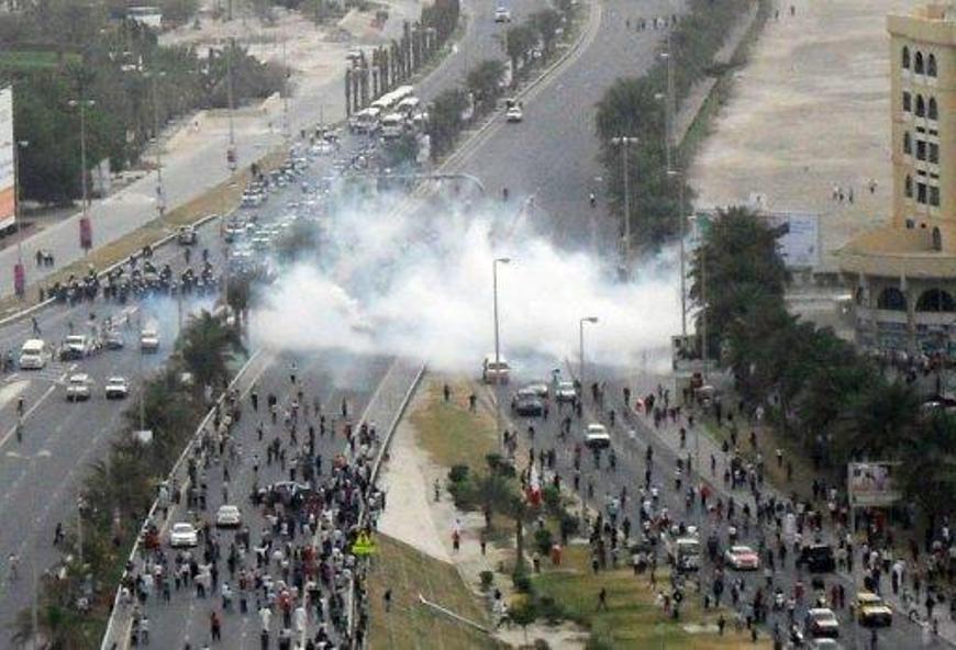 Bahraini anti-regime protesters under tear gas