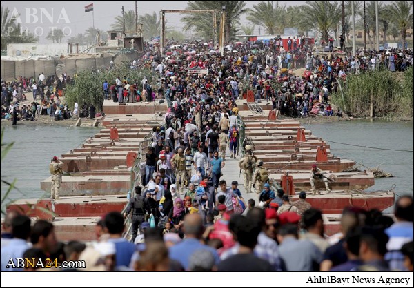 بالصور / داعش التكفيري تسبب بنزوح جماعي من محافظة الرمادي