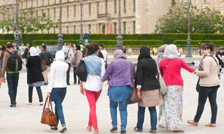 France under pressure to clarify rules about wearing long skirts and Muslim robes to school; 150 Muslim girls sent home in last 