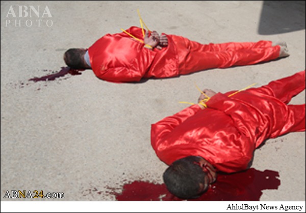 داعش التكفيري يصلب شخصين بعد اعدامهما في القائم + صور