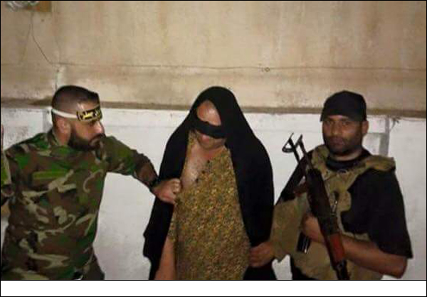 عناصر داعش يحلقون لحاهم ويرتدون ملابس النساء للهرب من الفلوجة + صورة