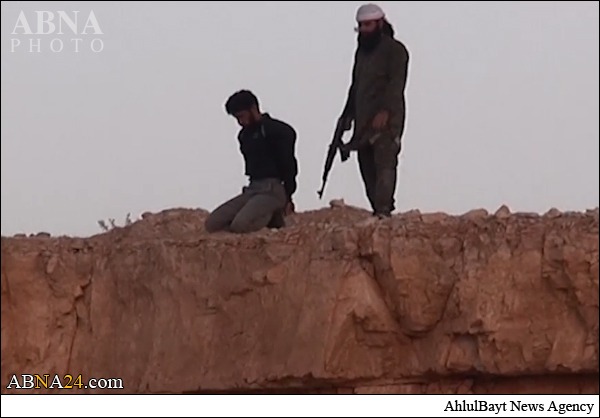 ISIS executes Syrian soldier and kicks his body off a cliff + Pics