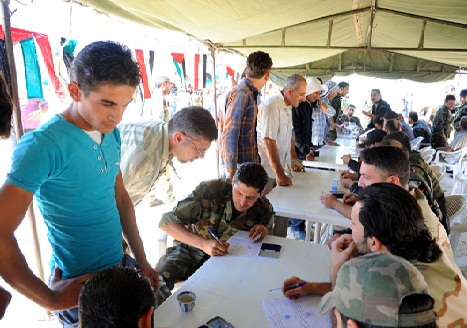84 wanted persons turn themselves in to Syria authorities in Homs