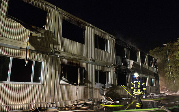 Suspected arson attack hits German refugee center, two injured