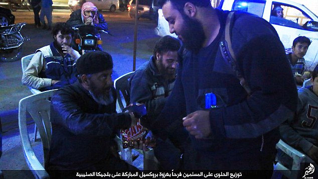 ISIS celebrate Brussels terror attacks by handing out sweets among its members
