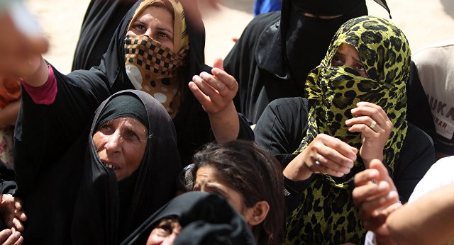 Starving Iraqi Women in Fallujah Shower ISIS Terrorists With Stones