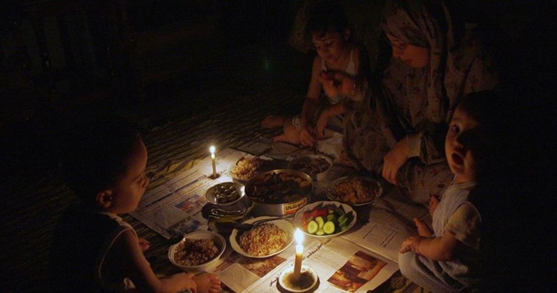 Three Gazan children burn to death in fire caused by candle