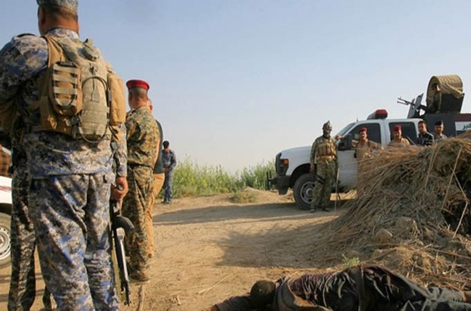 ثلاث عمليات انتحارية وهجوم مسلح على مركز للشرطة ببغداد