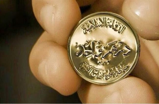 "داعش" يبدأ تداول عملته الذهبية الجديدة في الموصل+ (صور)