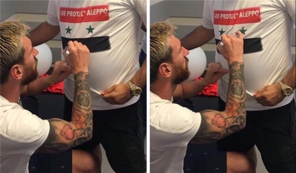 Lionel Messi Signs T-Shirt of Pro-Assad Fan
