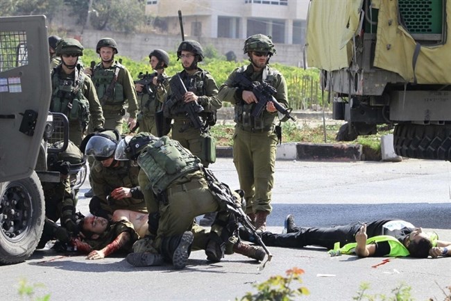 Israeli forces fire tear gas at Palestinians watching football match