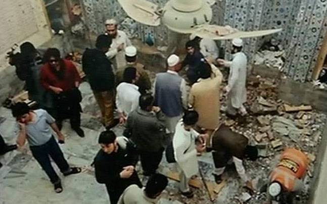 Bomb attack kills at least 16 people in northwest Pakistan mosque during Friday prayers