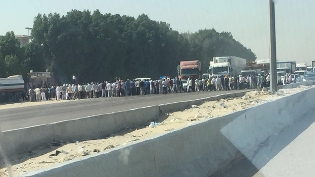 Foreign staff block Saudi road in protest over missing pay