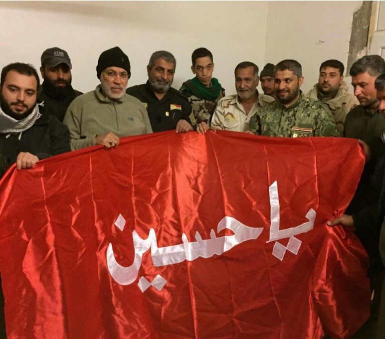 العتبة العباسية تسلم قيادة الحشد الشعبي ابو مهدي المهندس "راية الامام الحسين (ع)"