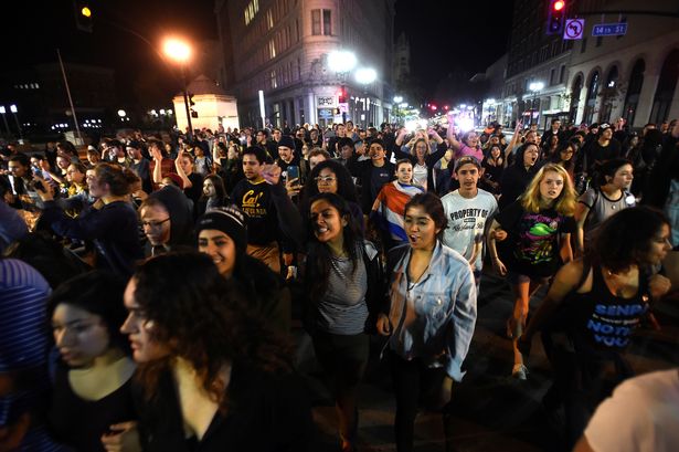 Trump's victory sparks riots across US as crowds burn American flag, chanting "Not Our President" / Pics