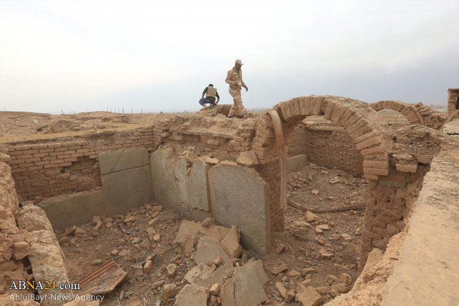 تقرير مصور/ اللوحات الجدارية والزقورة تتحول الى كومة من التراب بعد ان سوتها جرافات داعش