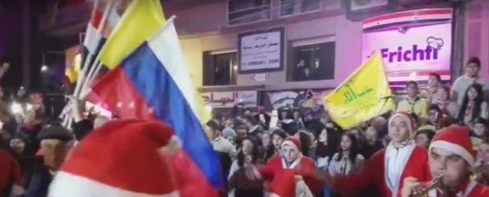 Flags of Hezbollah, Russia, Syria amongst Christmas celebration in liberated Aleppo / Video