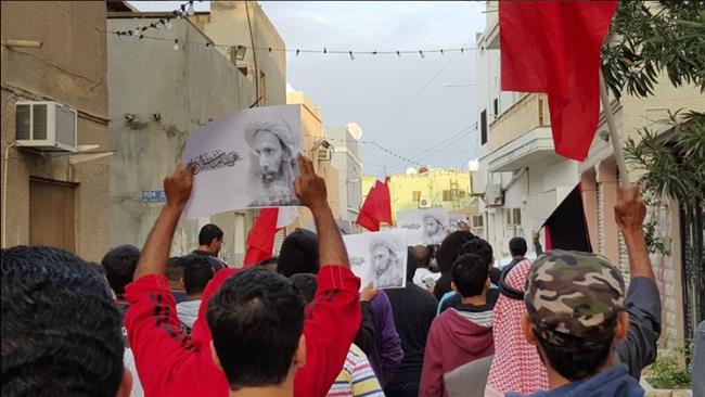 Bahraini people march in Manama on first anniversary of Sheikh Nimr's execution