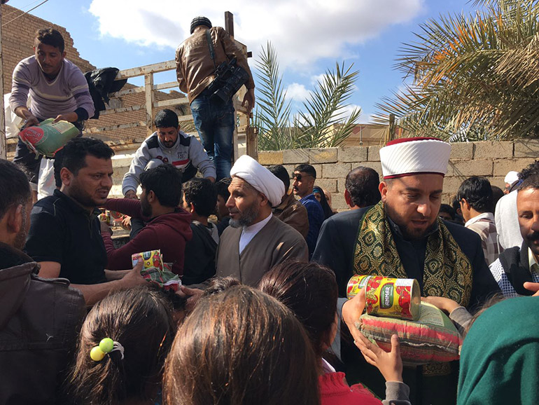War-torn families delivered humanitarian aid from Imam Hussain Holy Shrine / Pics