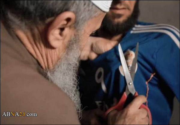 بواسطة مقص.. "داعش" تنزع شعار ريال مدريد !