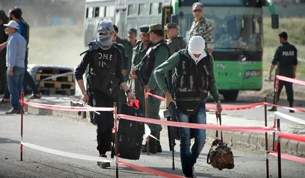 First group of militants leave Damascus’s al-Qaboun neighborhood