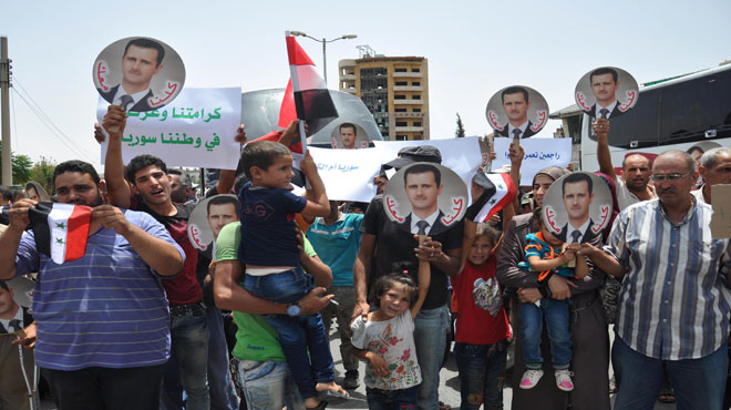 Syrian families return to al-Waer neighborhood in Homs / Pics