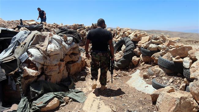 Hezbollah discovers Nusra Front mass grave on border with Syria