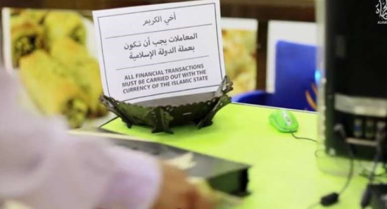 ISIS rolls out new pennies, bans use of dollars