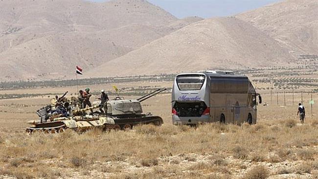 ISIS evacuation bus convoy stranded in Syrian desert splits in two