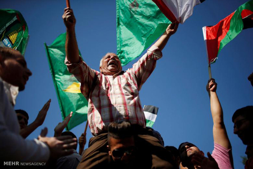 تصويري رپورٹ: فلسطینی تنظیموں حماس اور فتح کے درمیان دس سالہ اختلاف ختم 