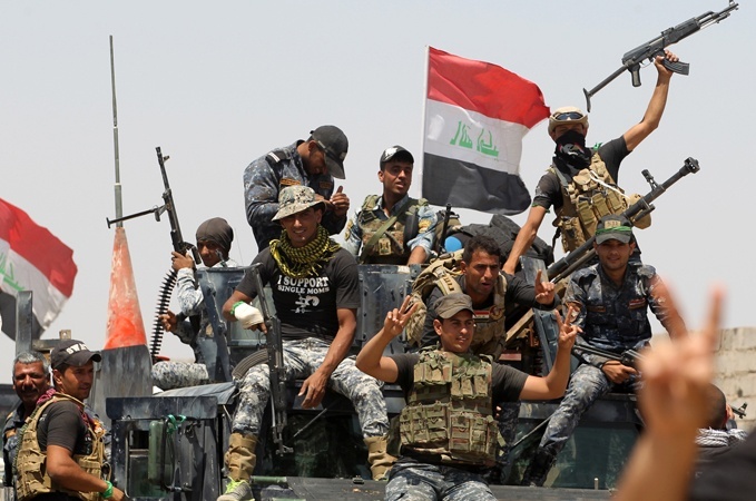 الحشد الشعبي يعيد الحياة التجارية مع سوريا والأردن