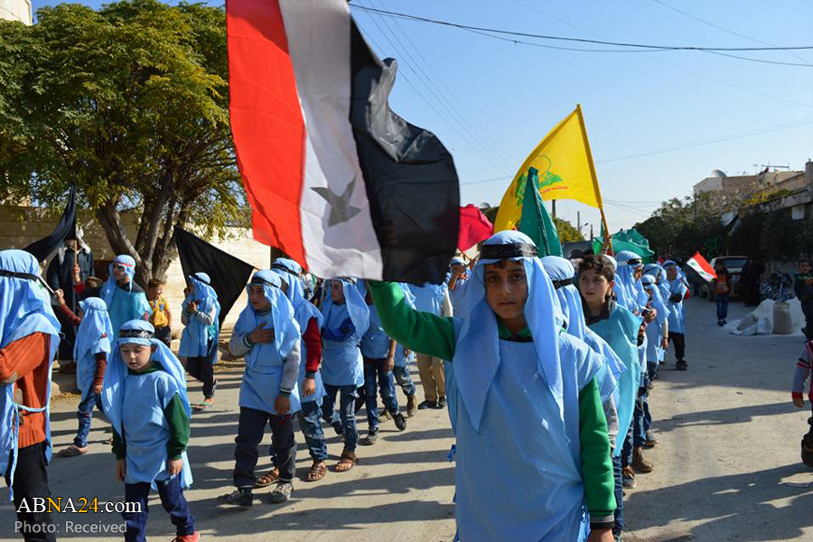 تقرير مصور/ مسيرة أربعينية الامام الحسين (ع) في مدينة الزهراء السورية