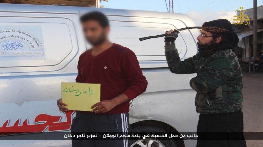 ISIS sharia police in Syria whip tobacco dealer and then shake his hand for forgiveness 