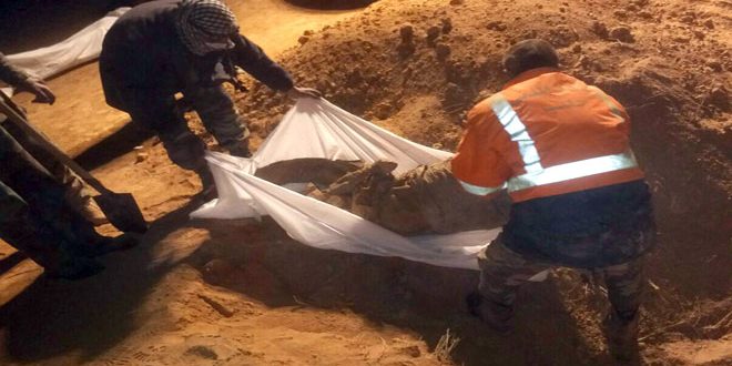 Syrian Army discovers mass grave of 8 martyrs in Raqqa