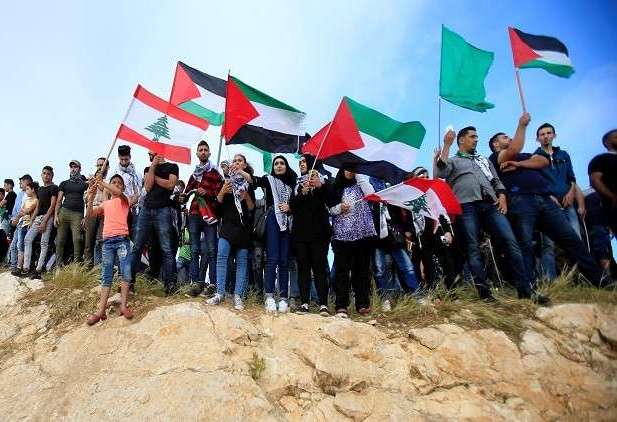 "مئات الفلسطينيين" يتظاهرون قرب حدود لبنان مع الاحتلال