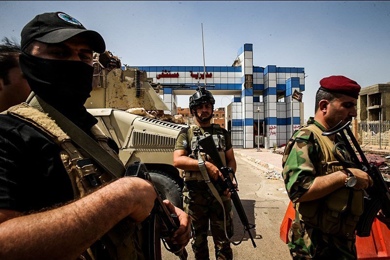 قوات الحشد الشعبي تمنع "دورية امريكية" من التجول في الموصل +(صور)