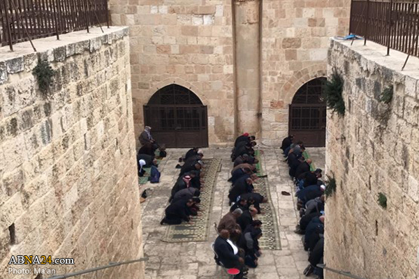 Palestinians perform prayers at sealed Al-Aqsa gate / Pics
