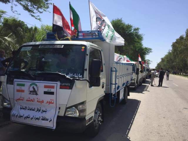 الحشد الشعبي العراقي يقدم قافلة مساعدات الى ضحايا السيول في إيران
