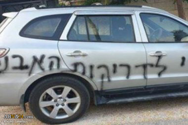 Illegal Israeli colonists puncture tires, write racist graffiti in Deir Istiya