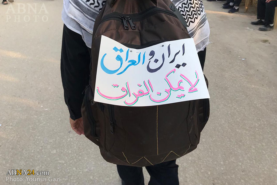 تقرير مصور/ شعارات أربعينية الامام الحسين (ع) في العراق