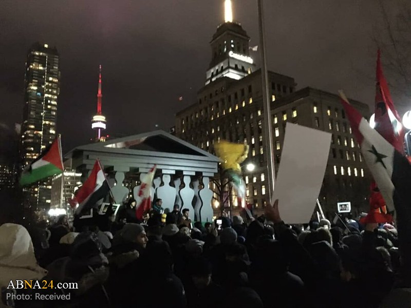 تقرير مصور/ تجمع أمام القنصلية الامريكية في تورنتو الكندية تنديداً بالعملية الارهابية 