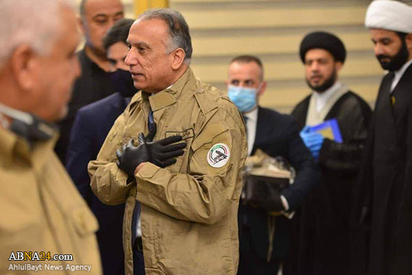 Iraqi PM wears Hashd al-Sha’abi uniform in significant visit to its command center (+Photos)