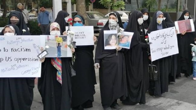 Iranian university students gather outside Swiss Embassy to slam US brutality against Afro-Americans