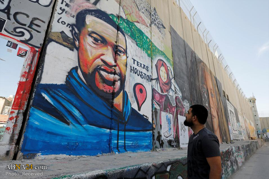 Video: George Floyd mural painted on West Bank barrier 