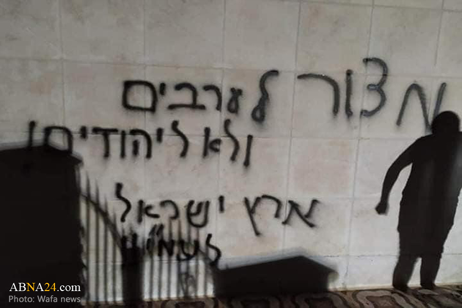 Israeli settlers set fire to mosque near Ramallah, spray racist graffiti on its walls