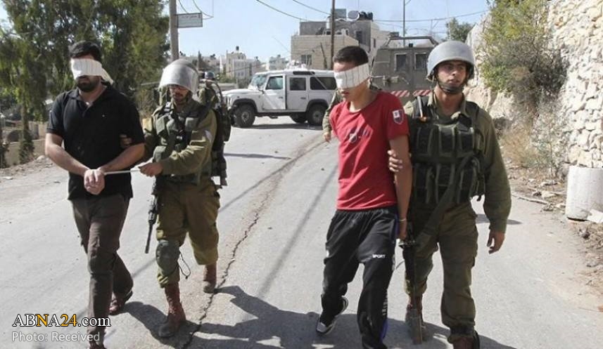 Zionist forces arrest 22 Palestinians in West Bank